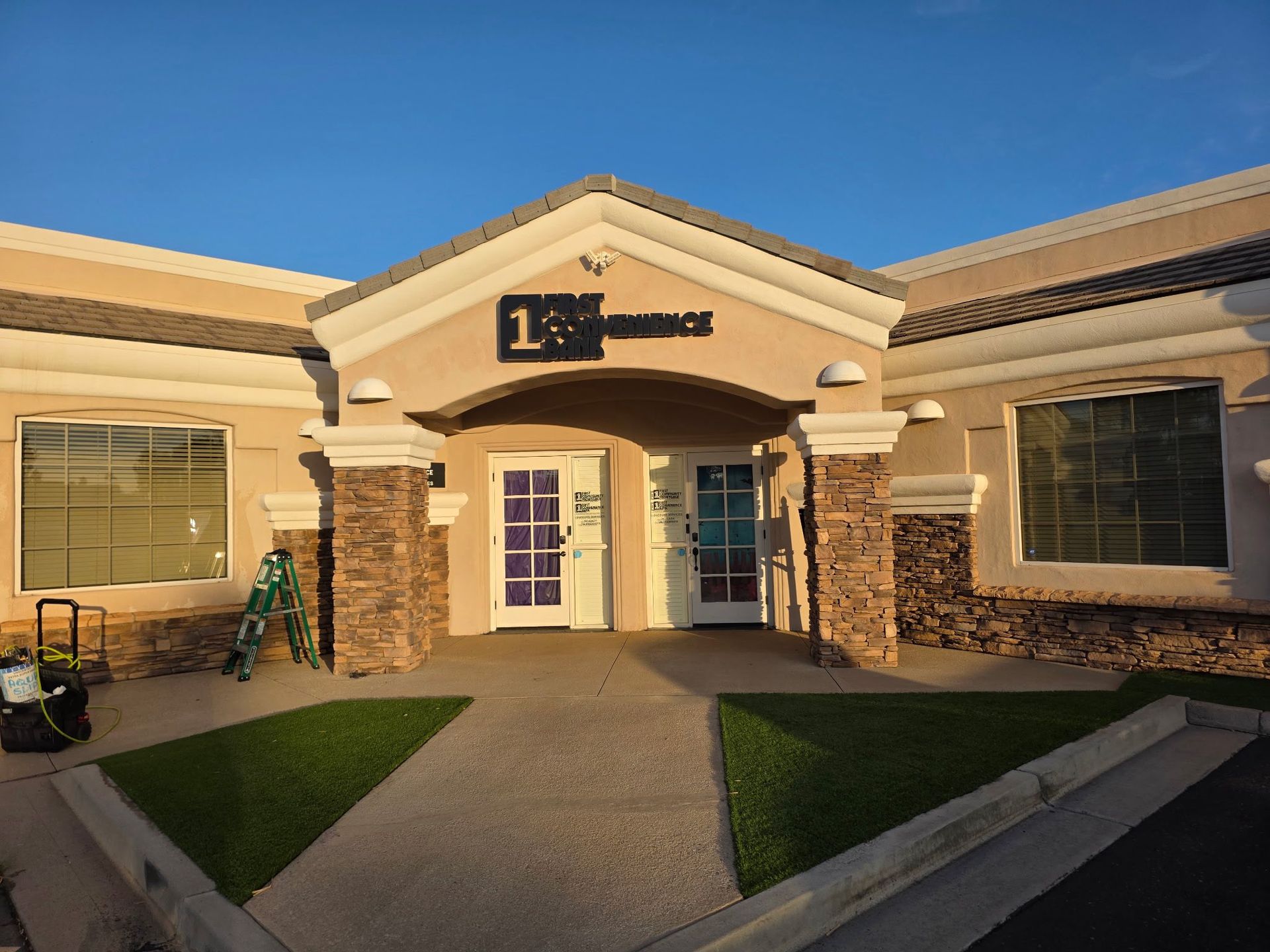 A sliding glass door with a view of a parking lot.