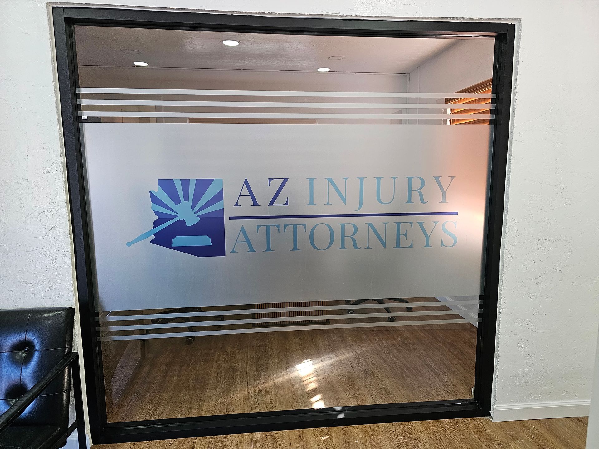 A window with the az injury attorneys logo on it
