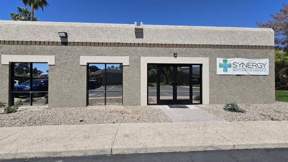 A building with a sign that says synergy on it