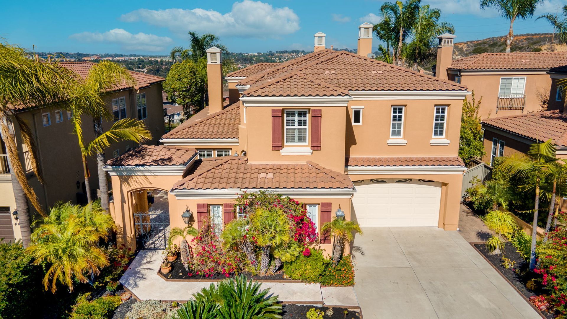 An aerial view of a large house in a residential area