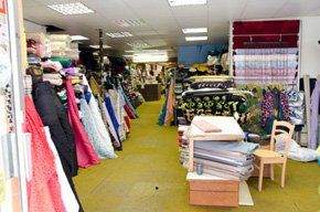  A fabric shop with different coloured and sized fabrics