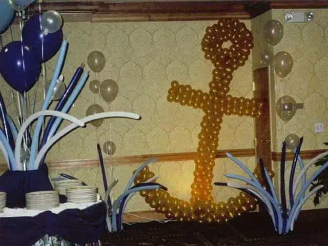 A large anchor made out of balloons in a room