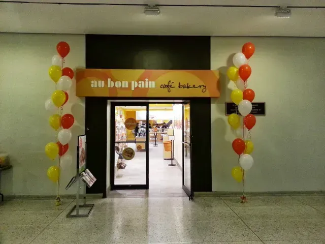 The entrance to au bon pain cafe bakery is decorated with balloons