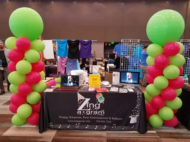 A table with a sign that says zing on it