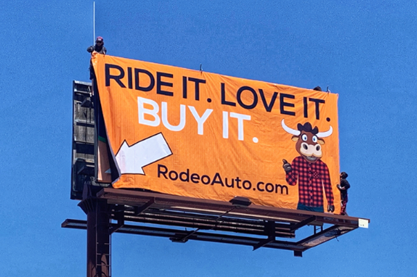 a billboard that says ride it love it buy it