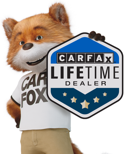 a fox holding a carfax lifetime dealer sign