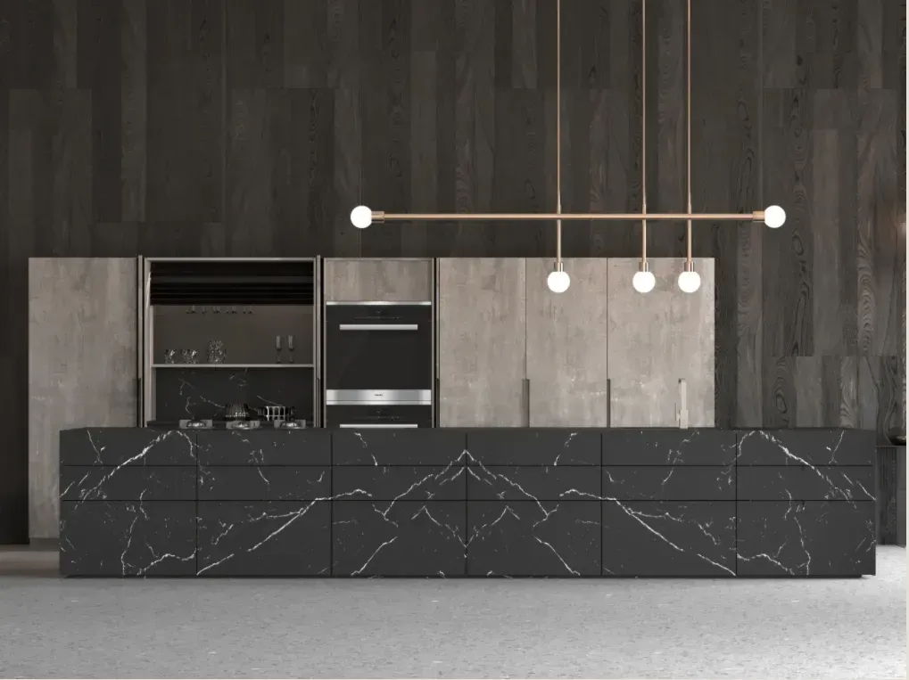 Modern kitchen with dark cabinetry and black marble island; pendant lights hang overhead.