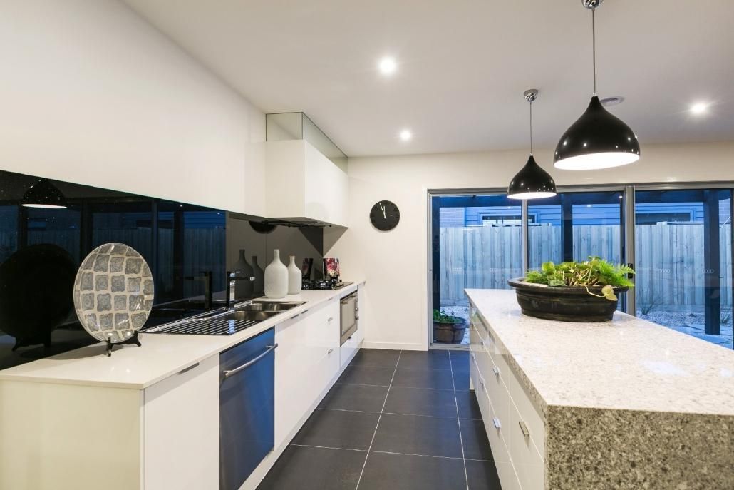 A Kitchen With a Large Island in the Middle of It — Lamont Builders In Woonona, NSW