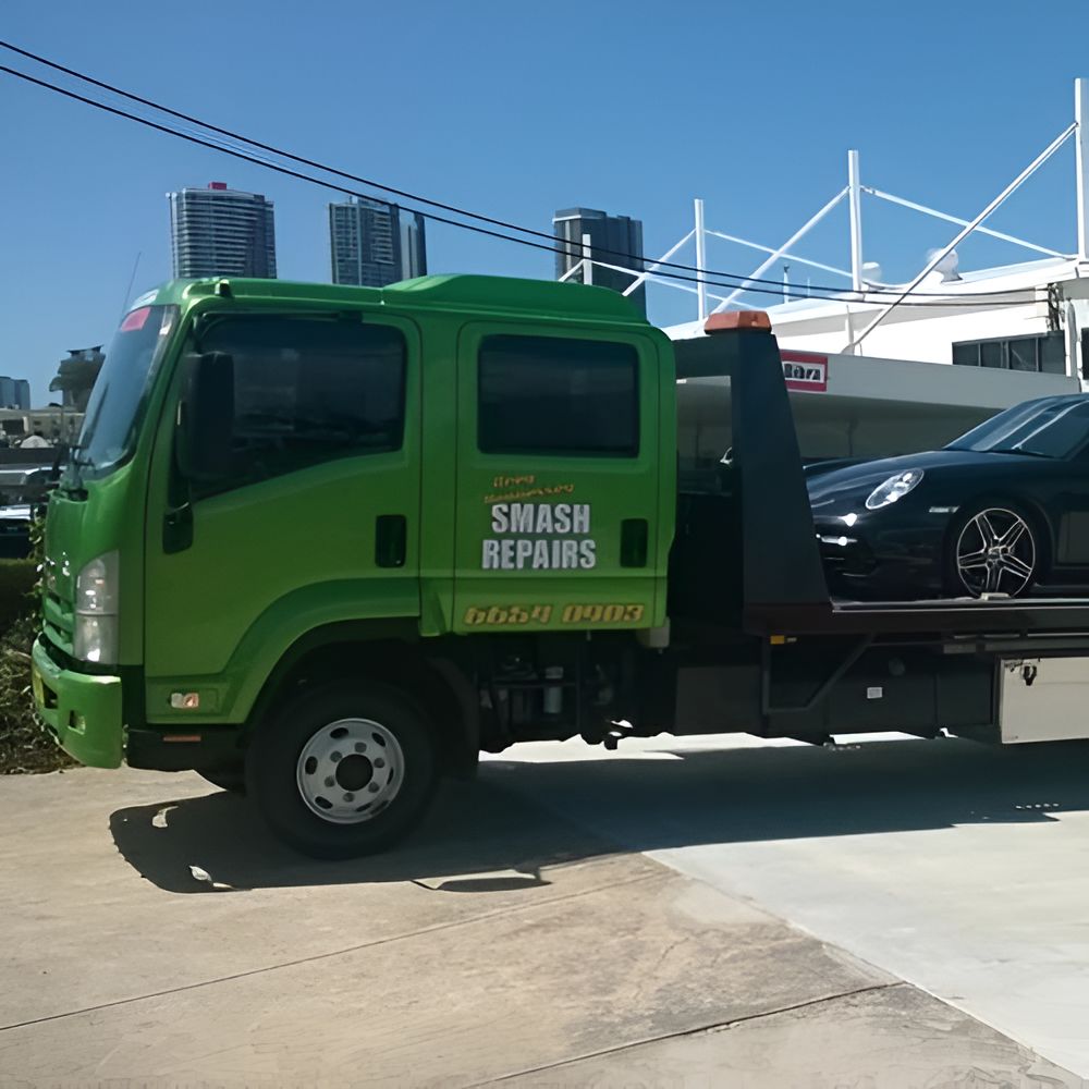 A Green Tow Truck Says Smash Repairs on the Side — Greg Hennessey Smash Repairs In Woolgoolga, NSW
