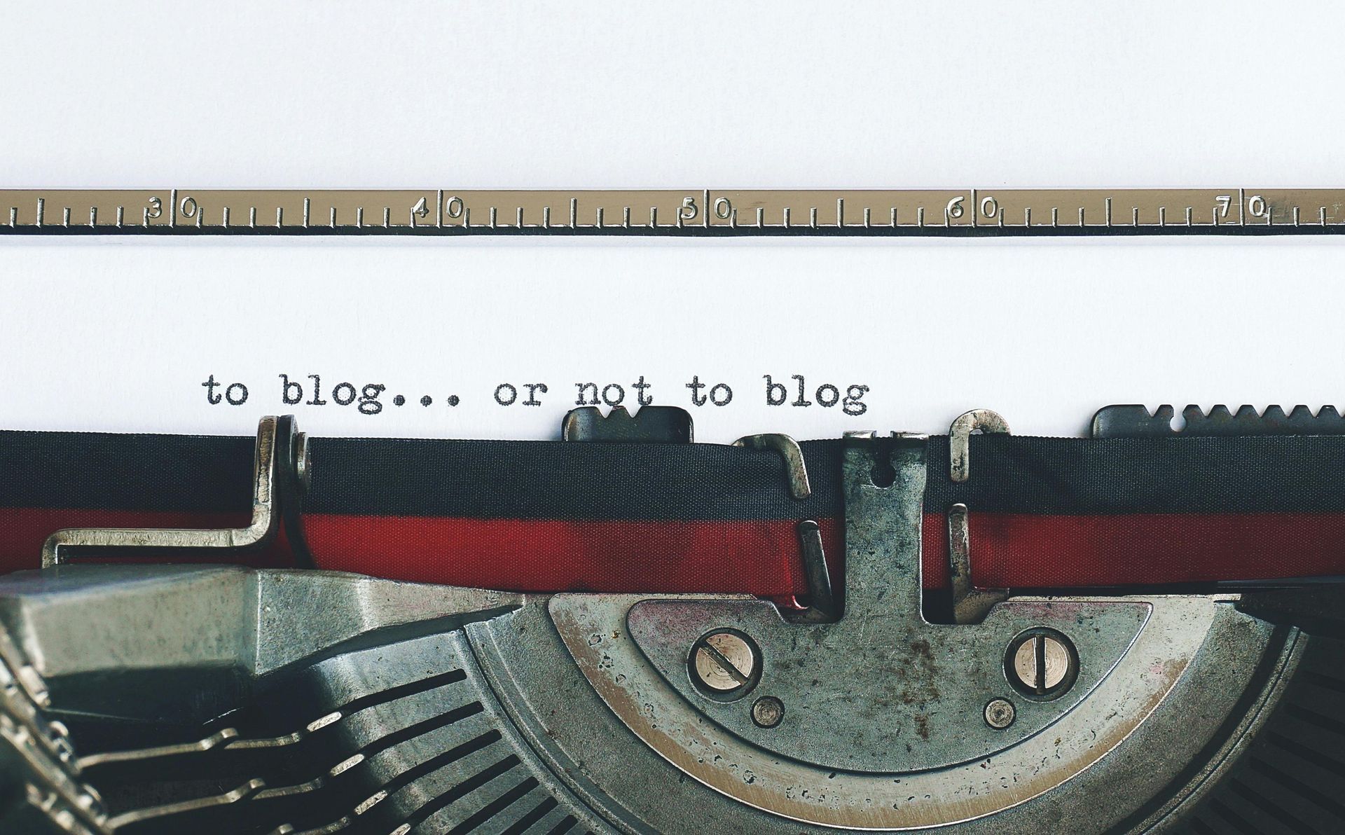 A typewriter with the words to blog or not to blog written on it