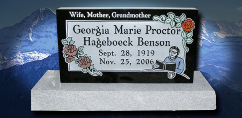 Gravestone of Georgia Marie Proctor Hageboeck Benson with birth and death dates, a rose design, and illustration of a woman reading.