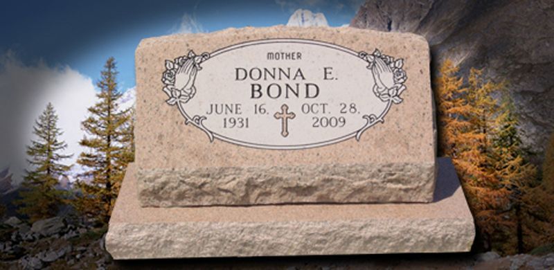 Headstone with the name Donna E. Bond, dates 1931-2009, and a cross on a stone base, outdoors.