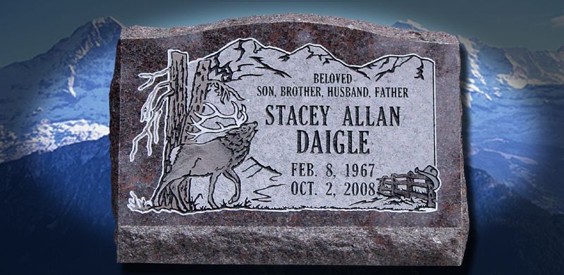 Gravestone for Stacey Allan Daigle, with mountain and wolf designs, and dates of birth and death.