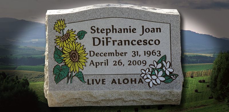 Gravestone with sunflowers, a flower design and inscription: 