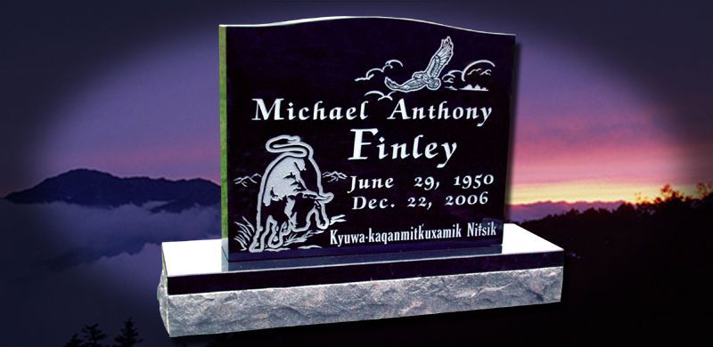 Gravestone of Michael Anthony Finley with dates June 19, 1960 - Dec. 22, 2006, set in a scenic background.
