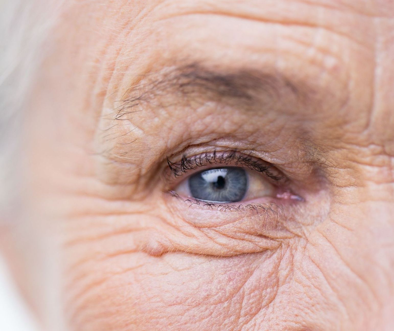closeup of elderly woman's blue eye