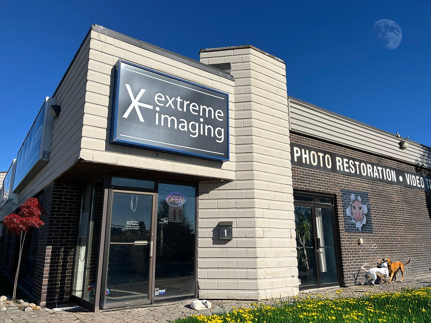 Front view of Extreme Imaging storefront with modern signage