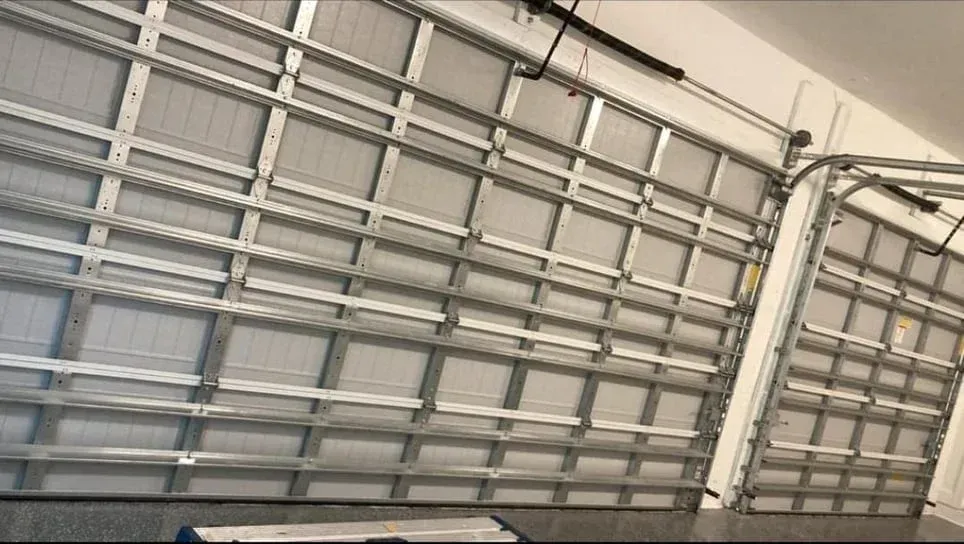 A close up of a garage door with the door open.