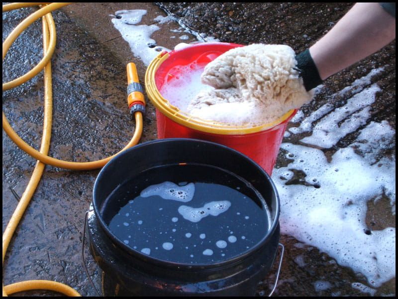 2 bucket method setup for safe car wash with wash bucket and rinse bucket
