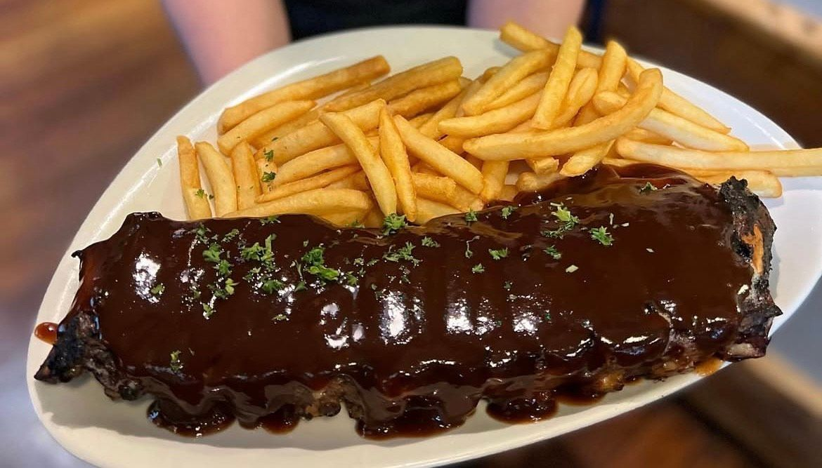 Full rack of BBQ ribs with golden fries. — The Shire Bar & Grill In Dubbo, NSW