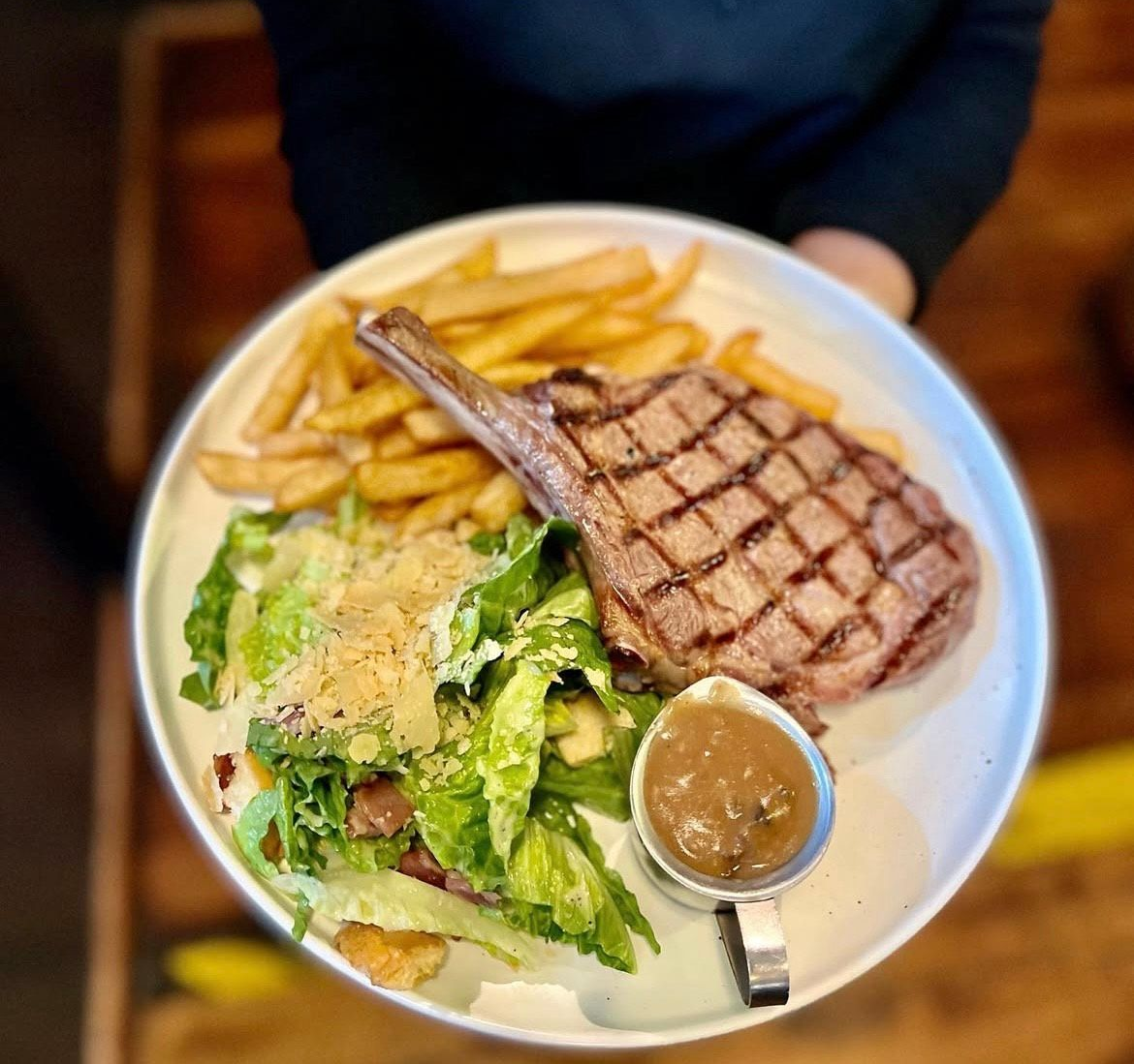 Grilled steak with chips, salad, and gravy. — The Shire Bar & Grill In Dubbo, NSW