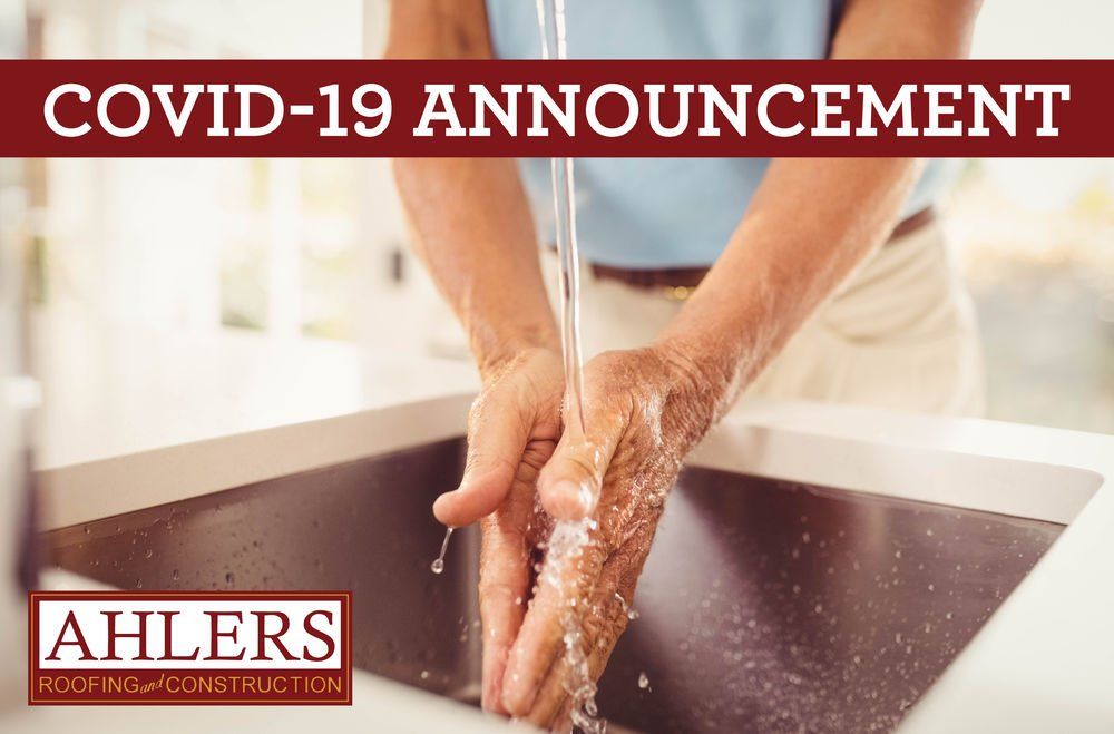 A man is washing his hands in a sink with the words covid-19 announcement above him