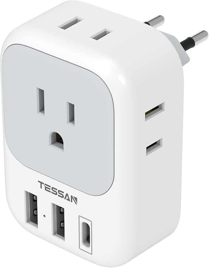 A white electrical outlet with two usb ports on it