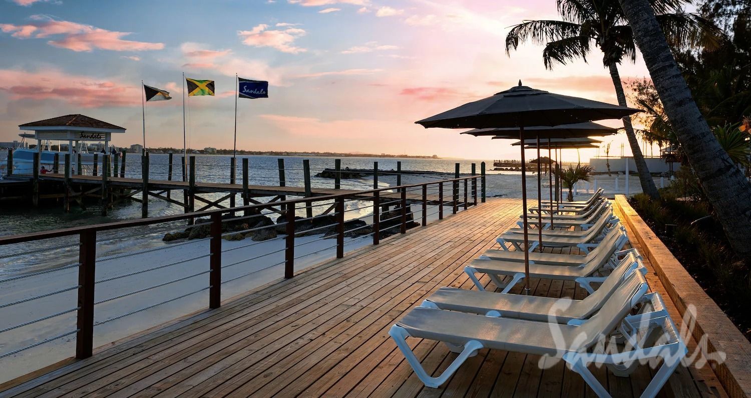 A dock with a lot of chairs and umbrellas on it