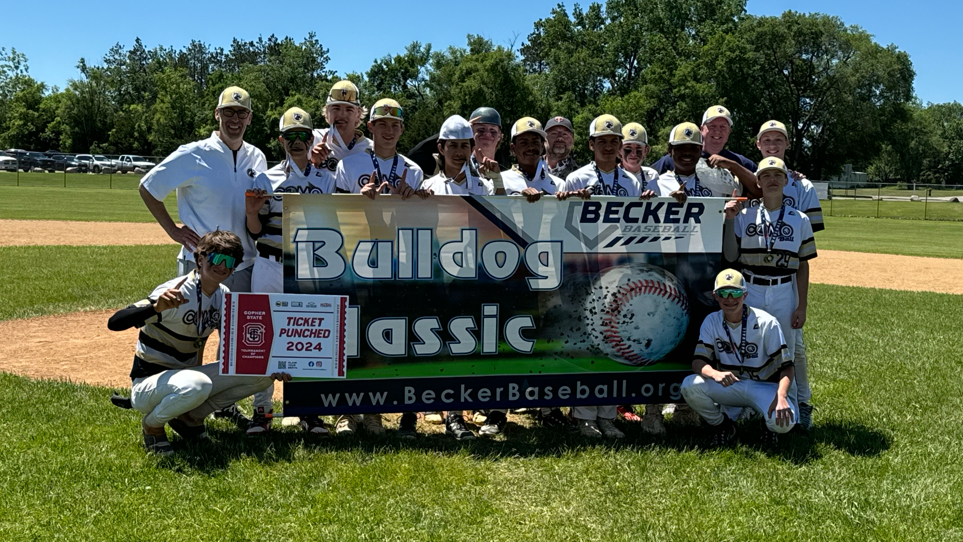 Our tournament team posing with a tournament banner