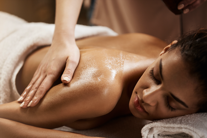 A woman is getting a massage at a spa.