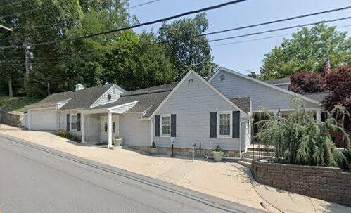 A funeral home in Westminster, MD with a welcoming entrance and landscaped frontage