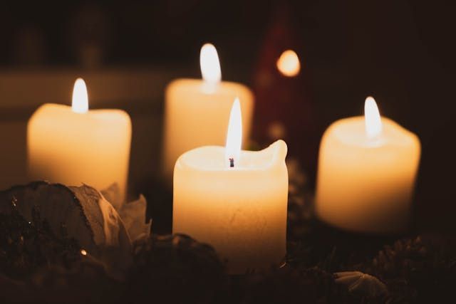 Glowing candles create a peaceful and comforting scene for cremation services Westminster, MD