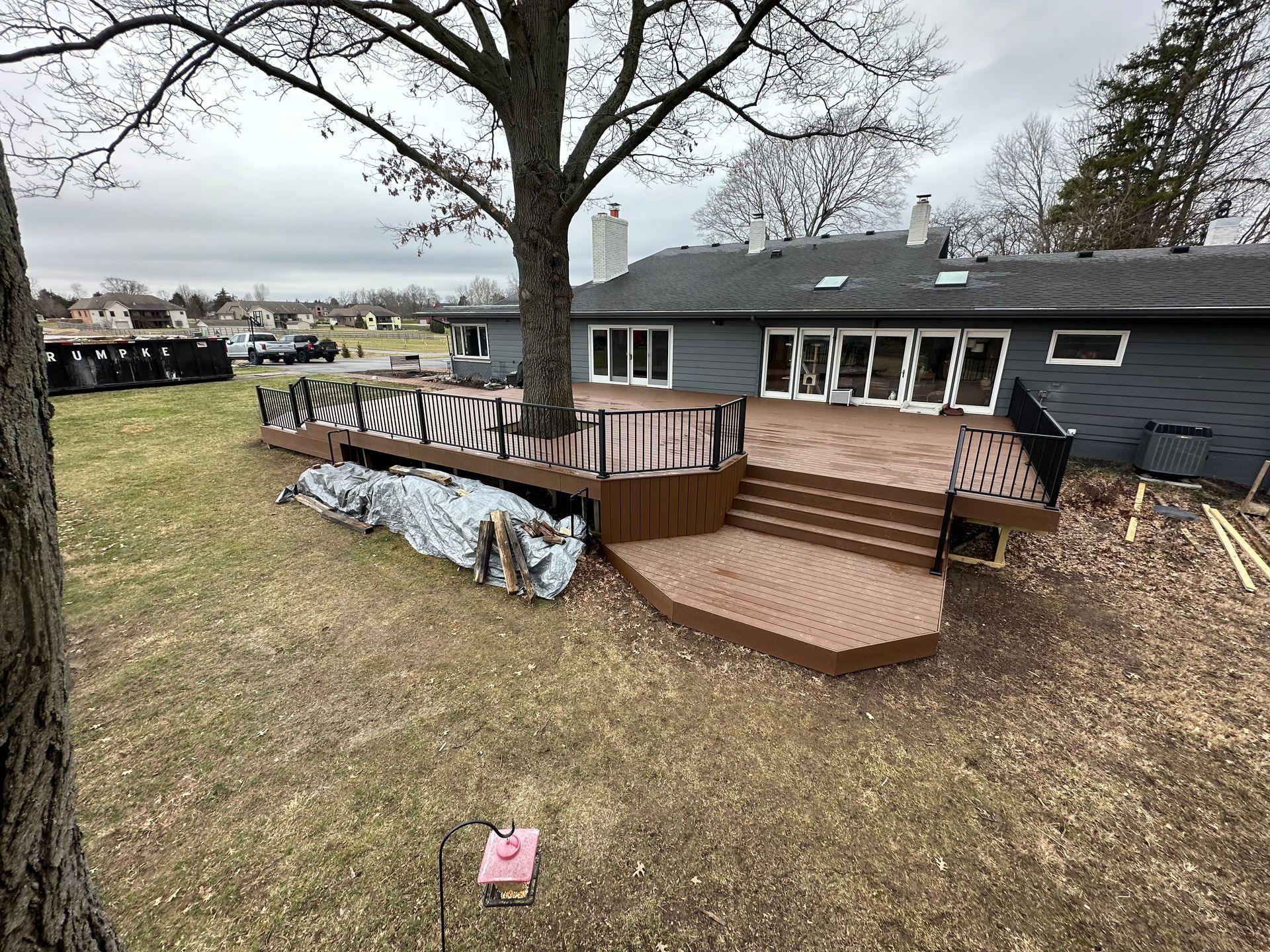 Saddle brown Trex enhanced with black aluminum railing  with landing