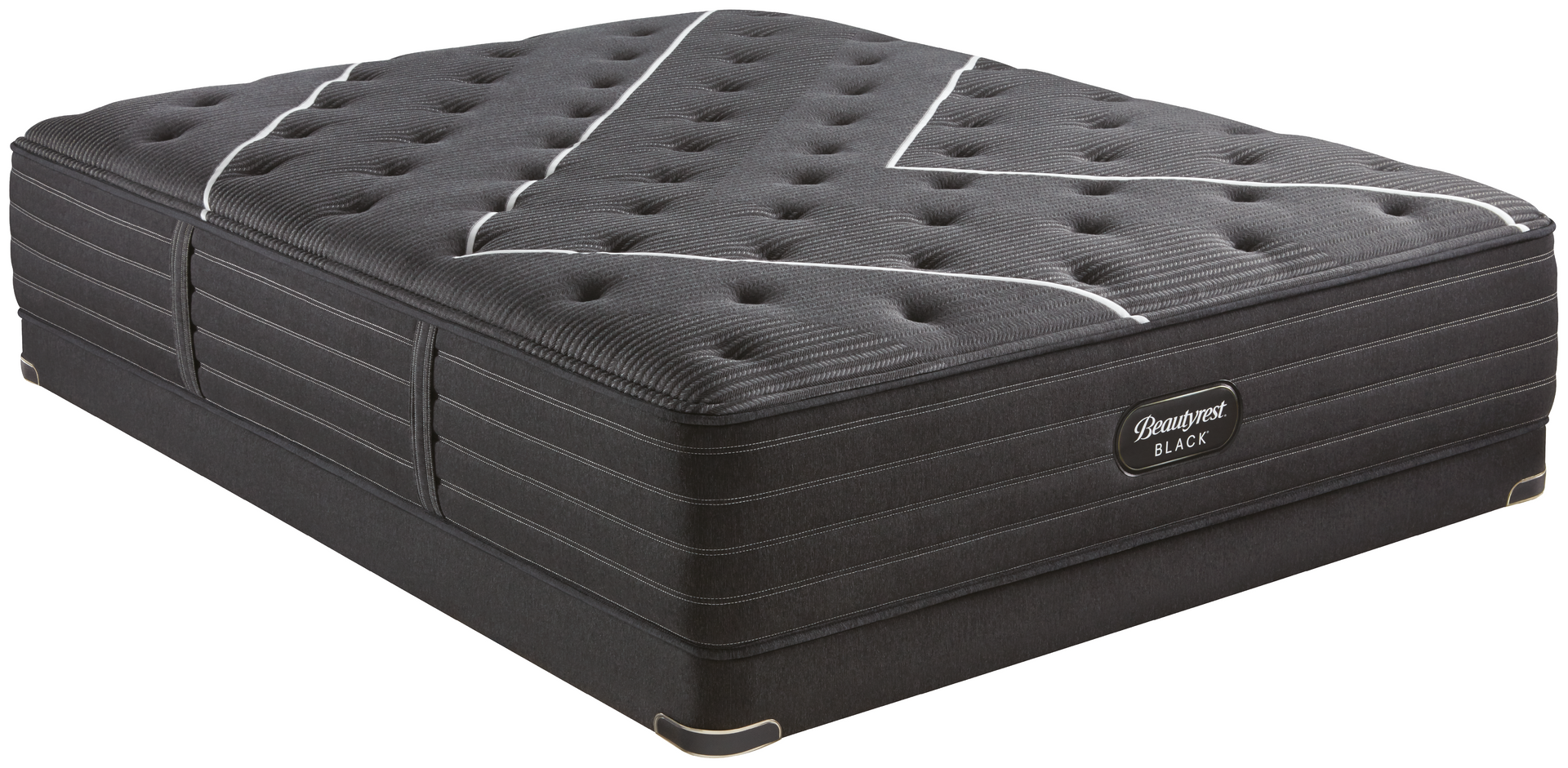 Un colchón negro está sobre una superficie blanca.