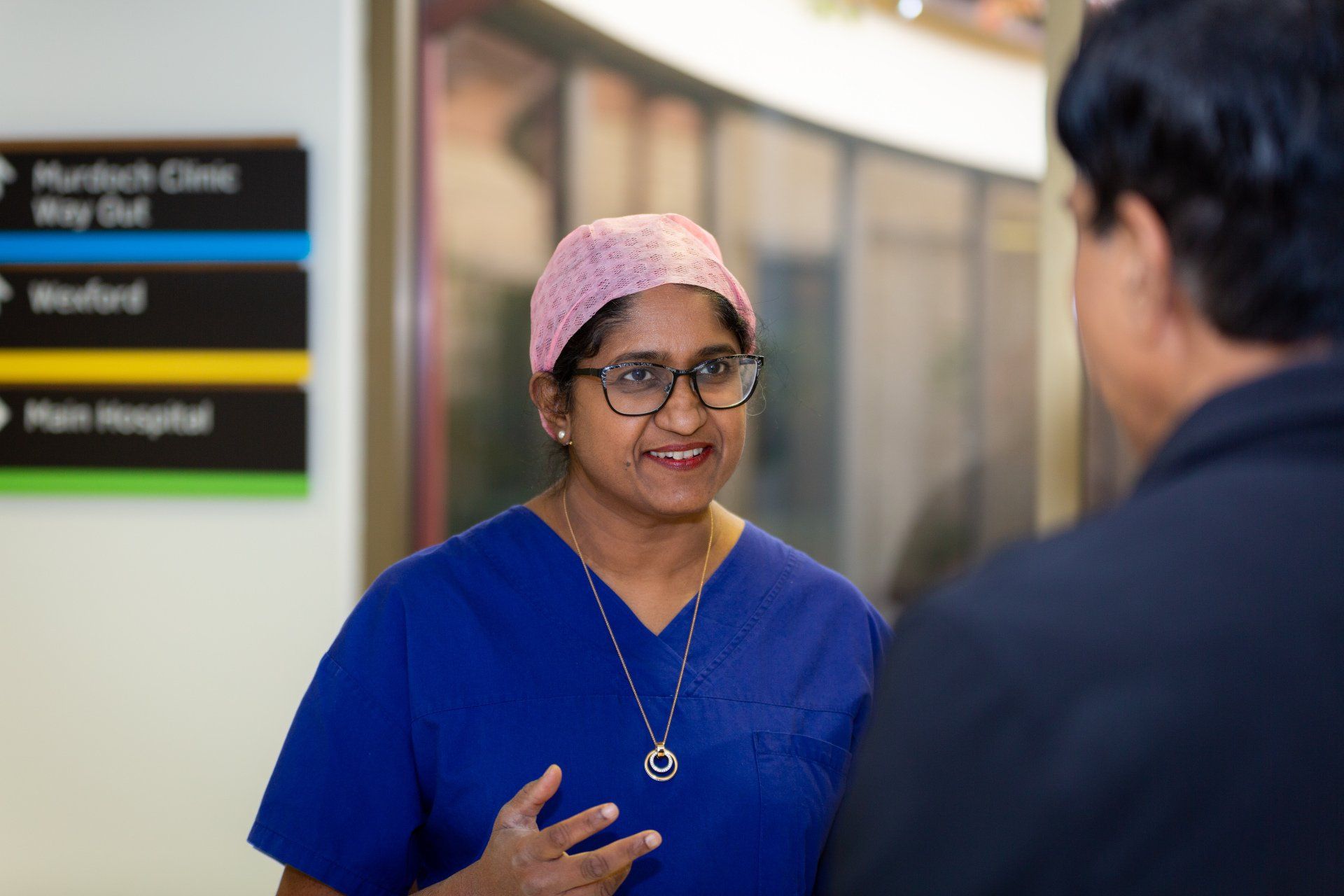 Dr Bindu talking to a patient