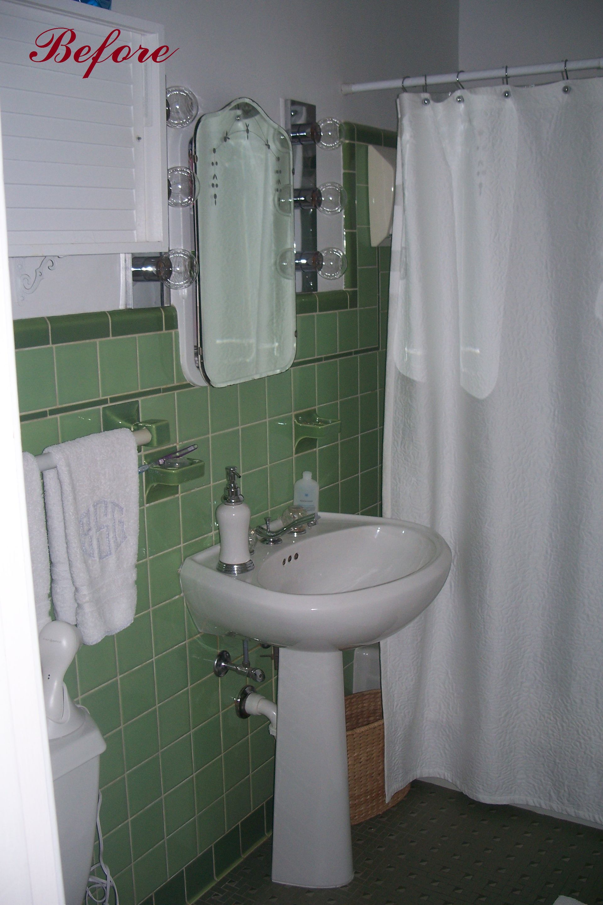 Green tiled bathroom with pedestal sink, white shower curtain, and a mirror.