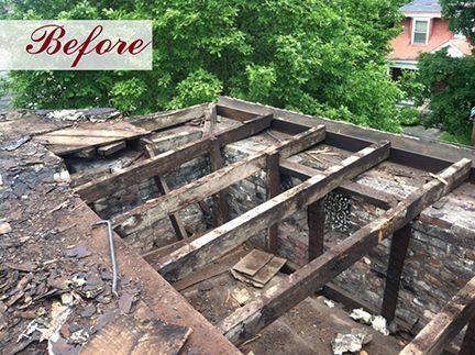 Damaged roof frame with exposed beams, ready for repair.