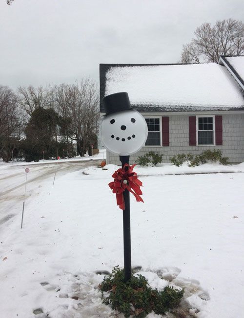snowman lamp post outside of our business