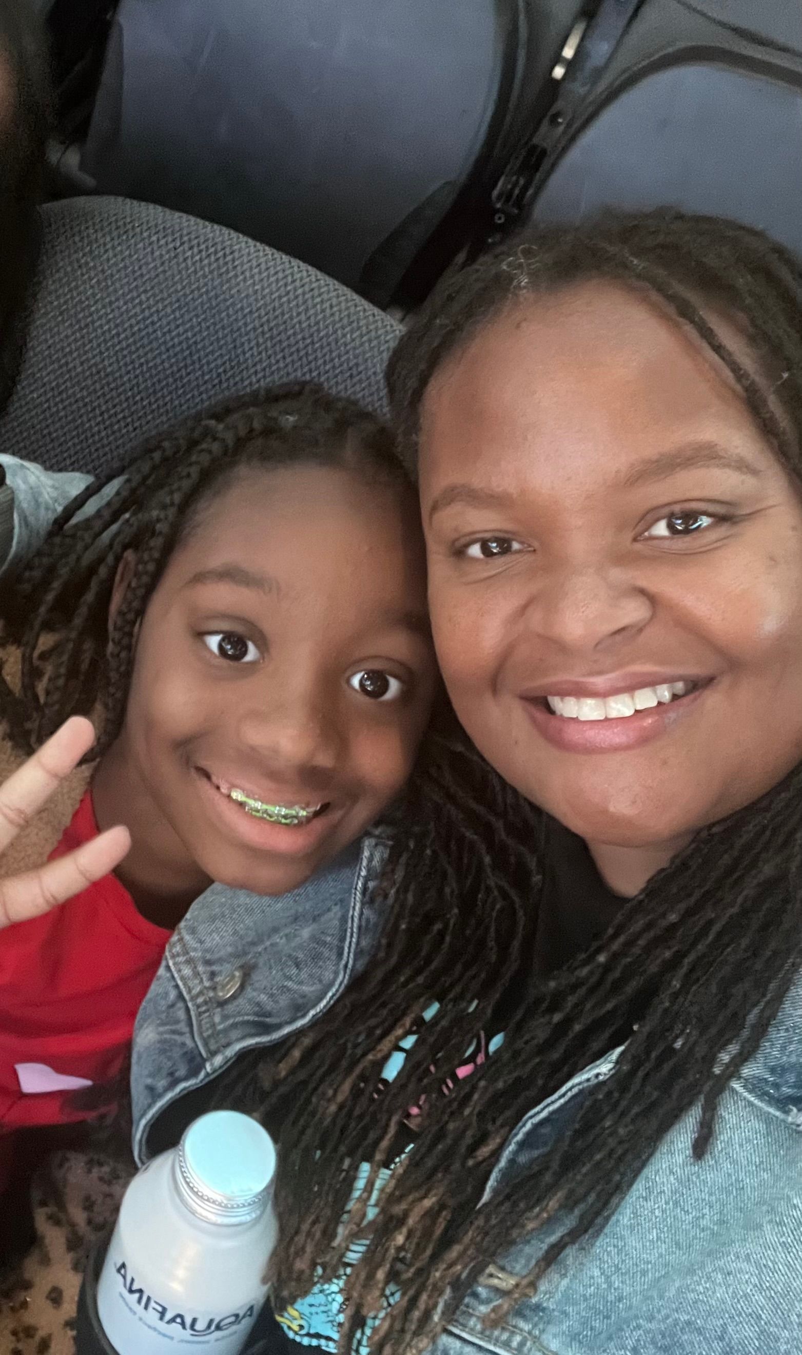 A woman and a child are posing for a picture together.