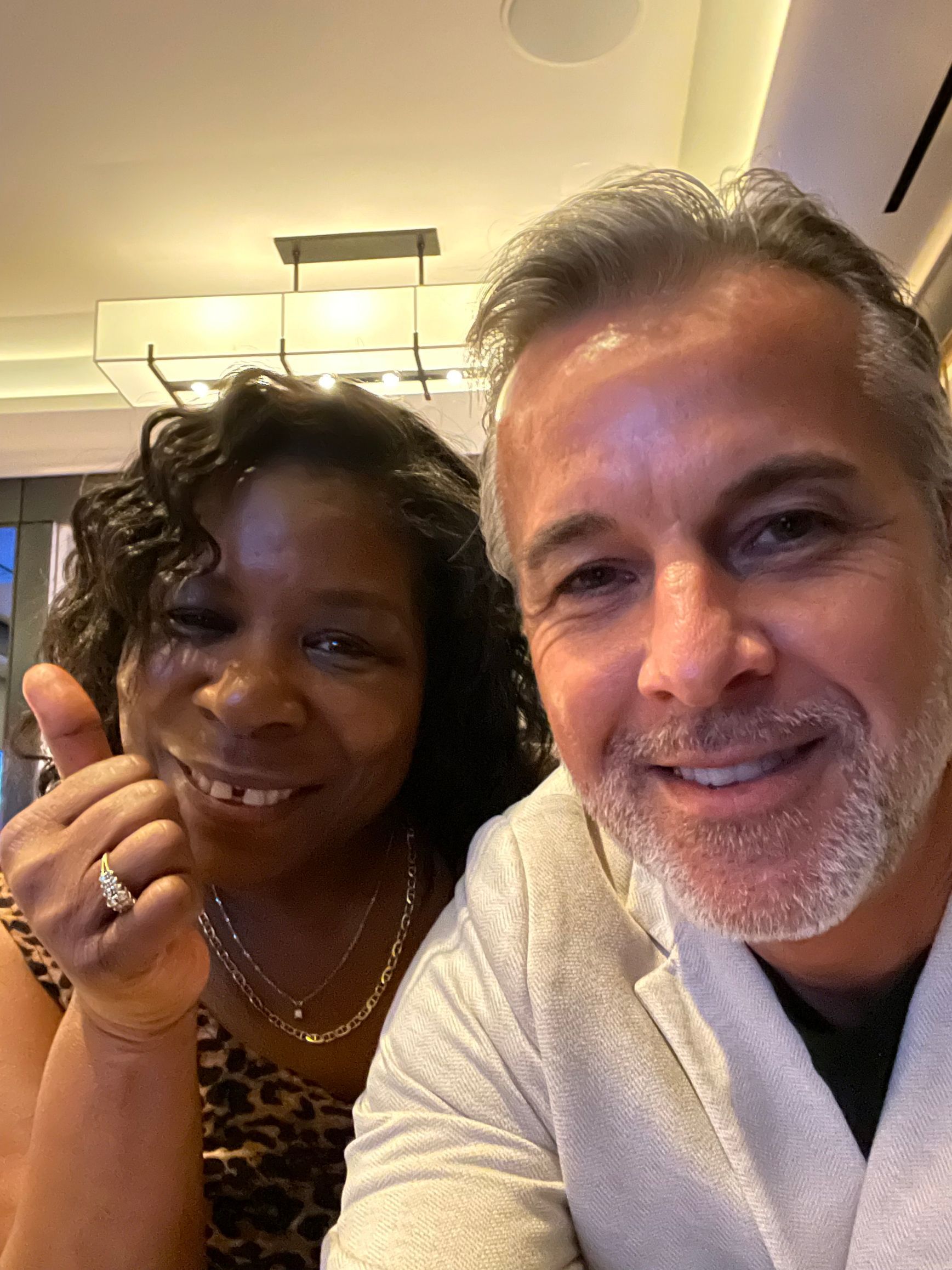 A man and a woman are posing for a picture together.