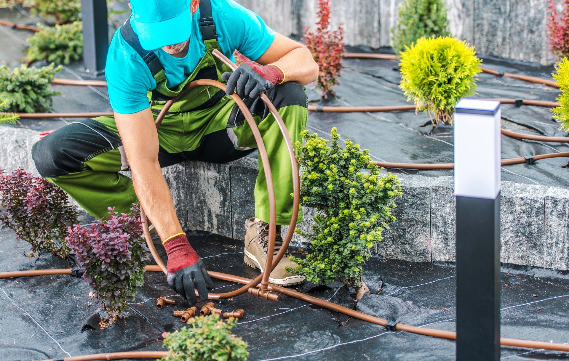 Gardener Installing Irrigation System — Denver, CO — Mile-Hi Sprinkler