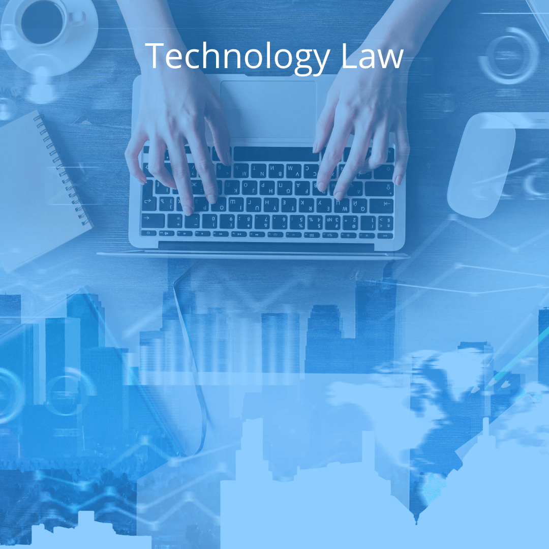 A person is typing on a laptop computer.