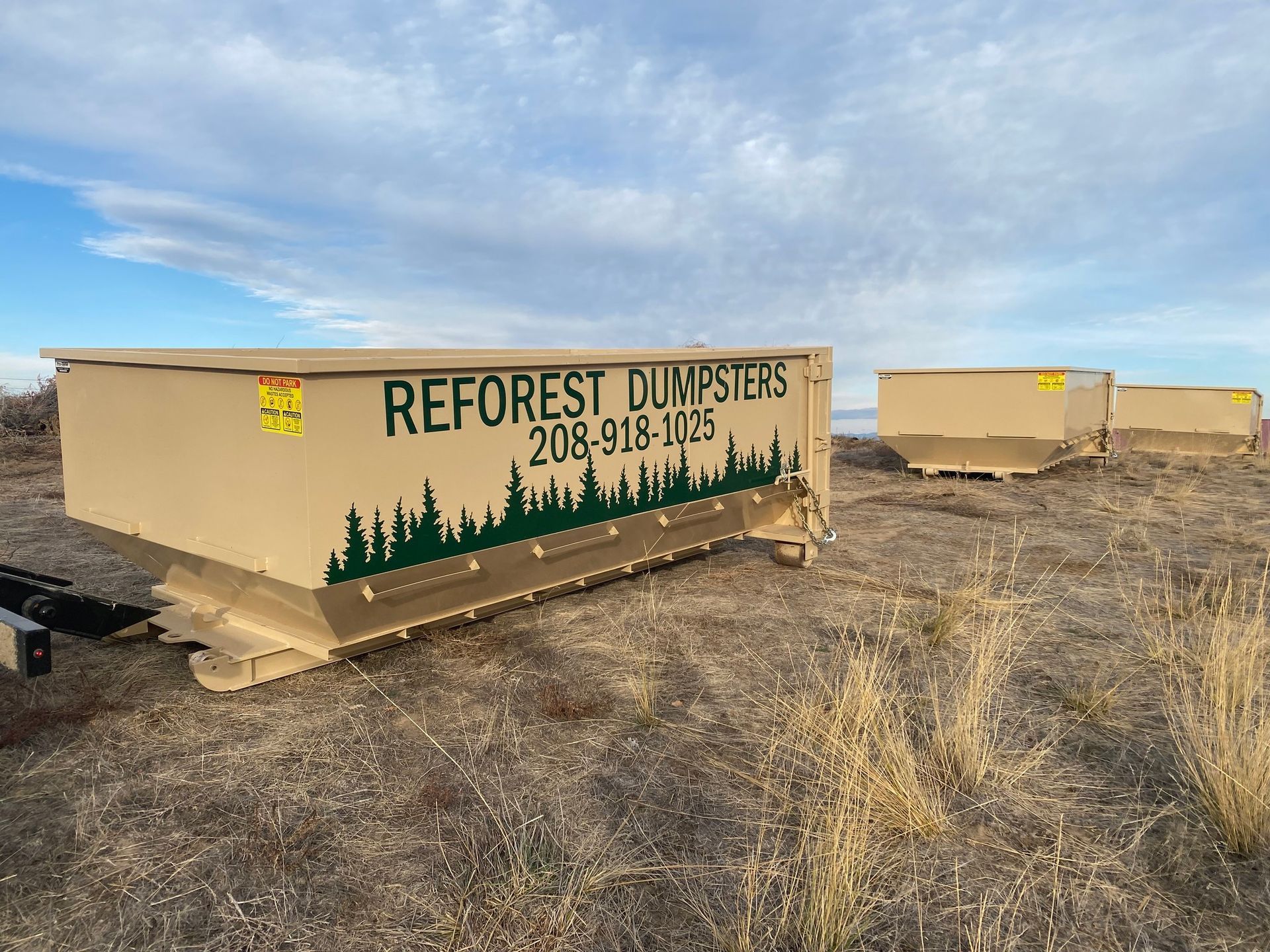 Tan dumpster trailer with 