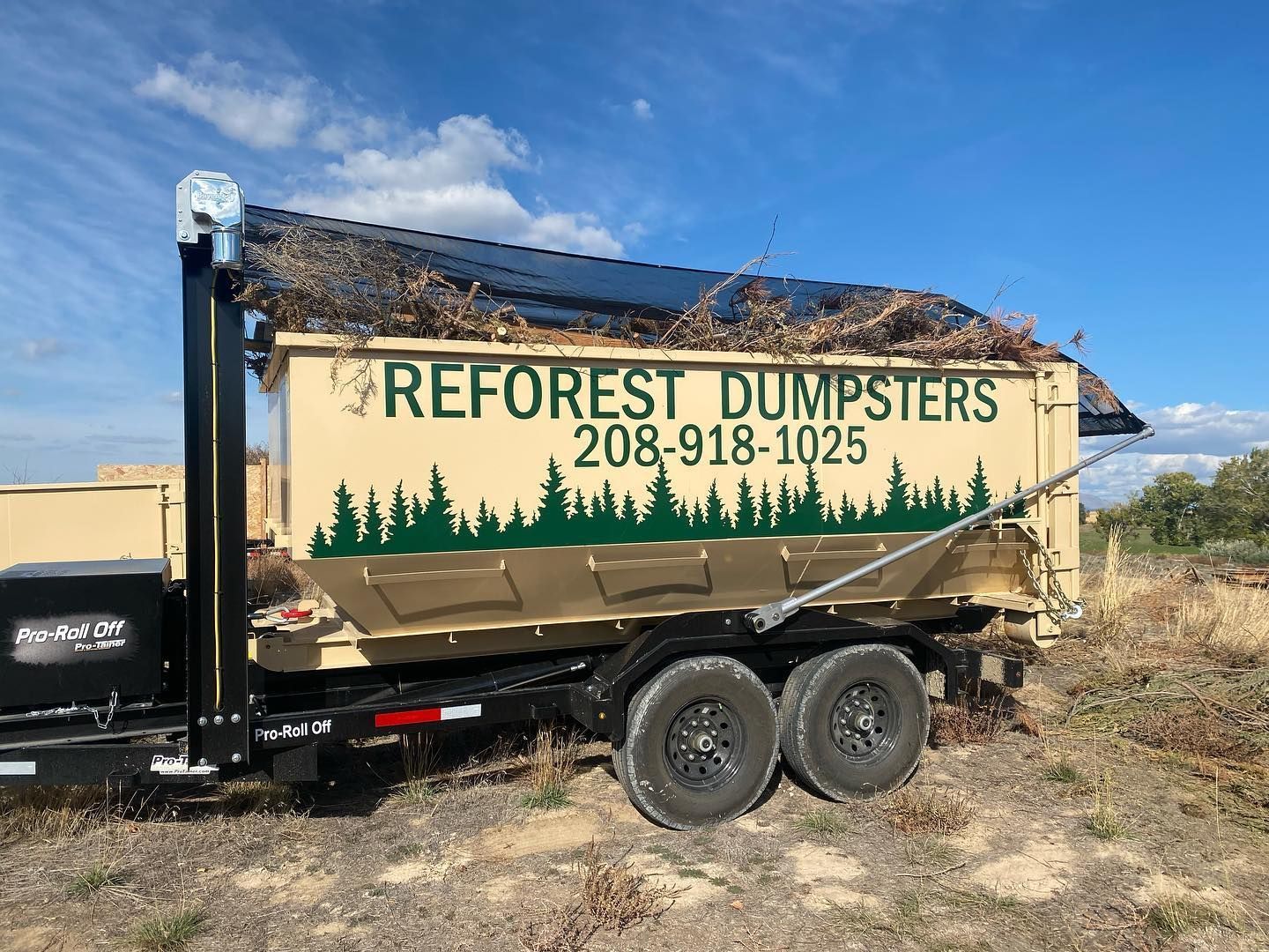 Tan dumpster trailer with 