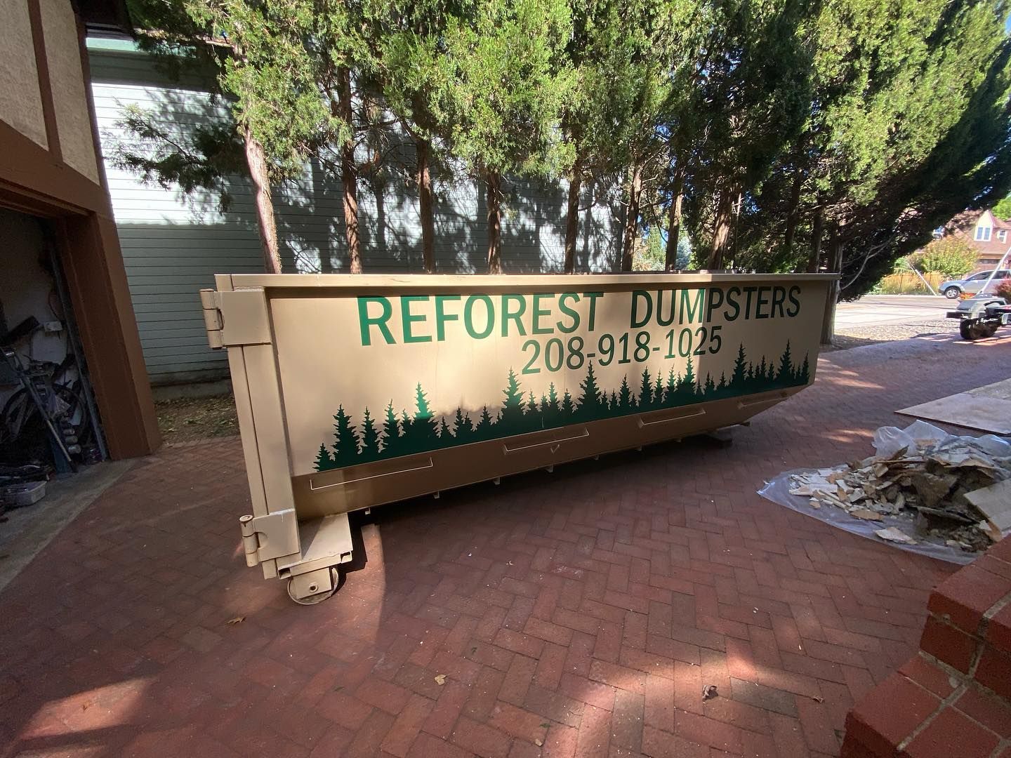 Tan dumpster trailer with