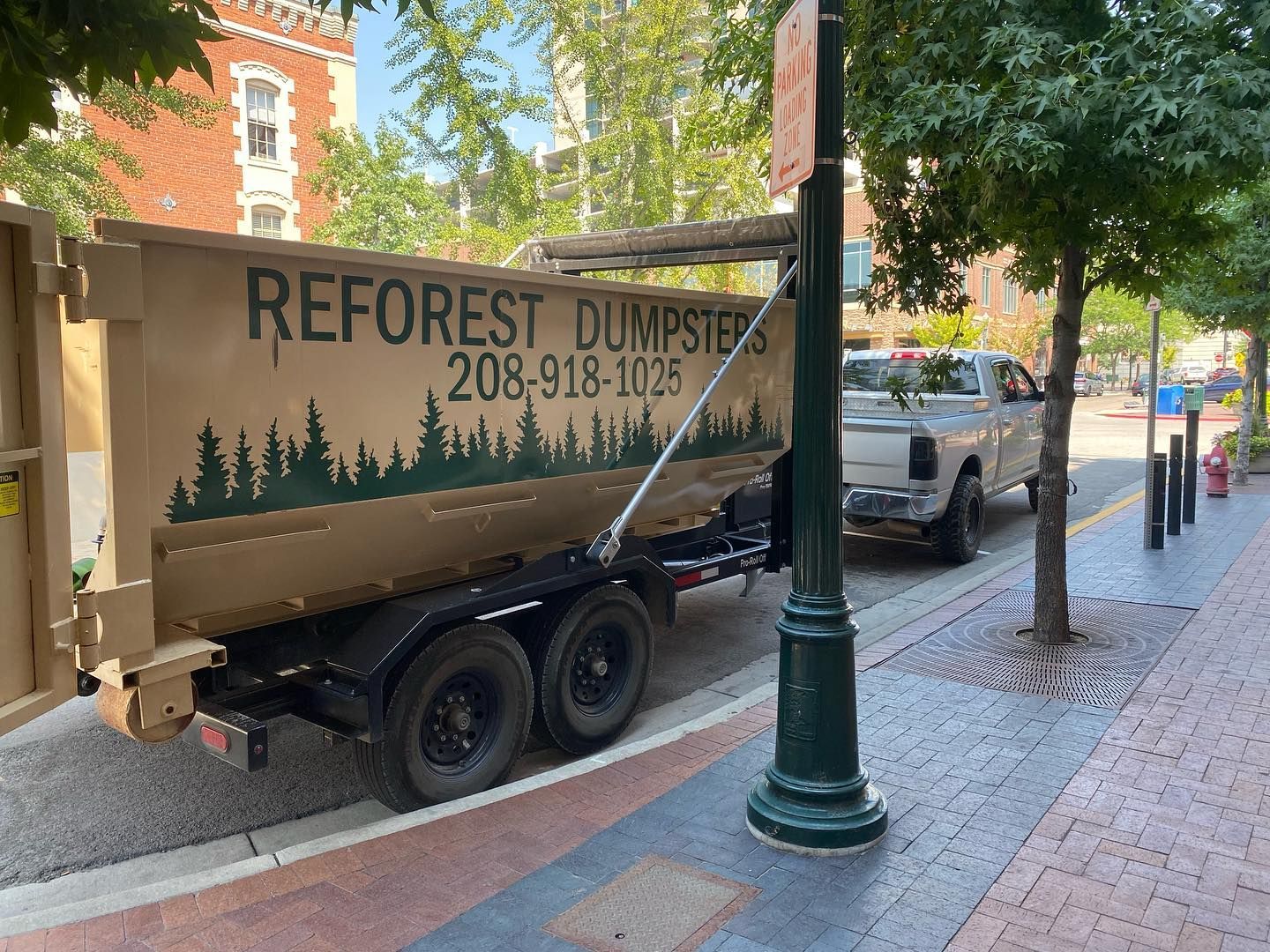 Tan dumpster trailer with 