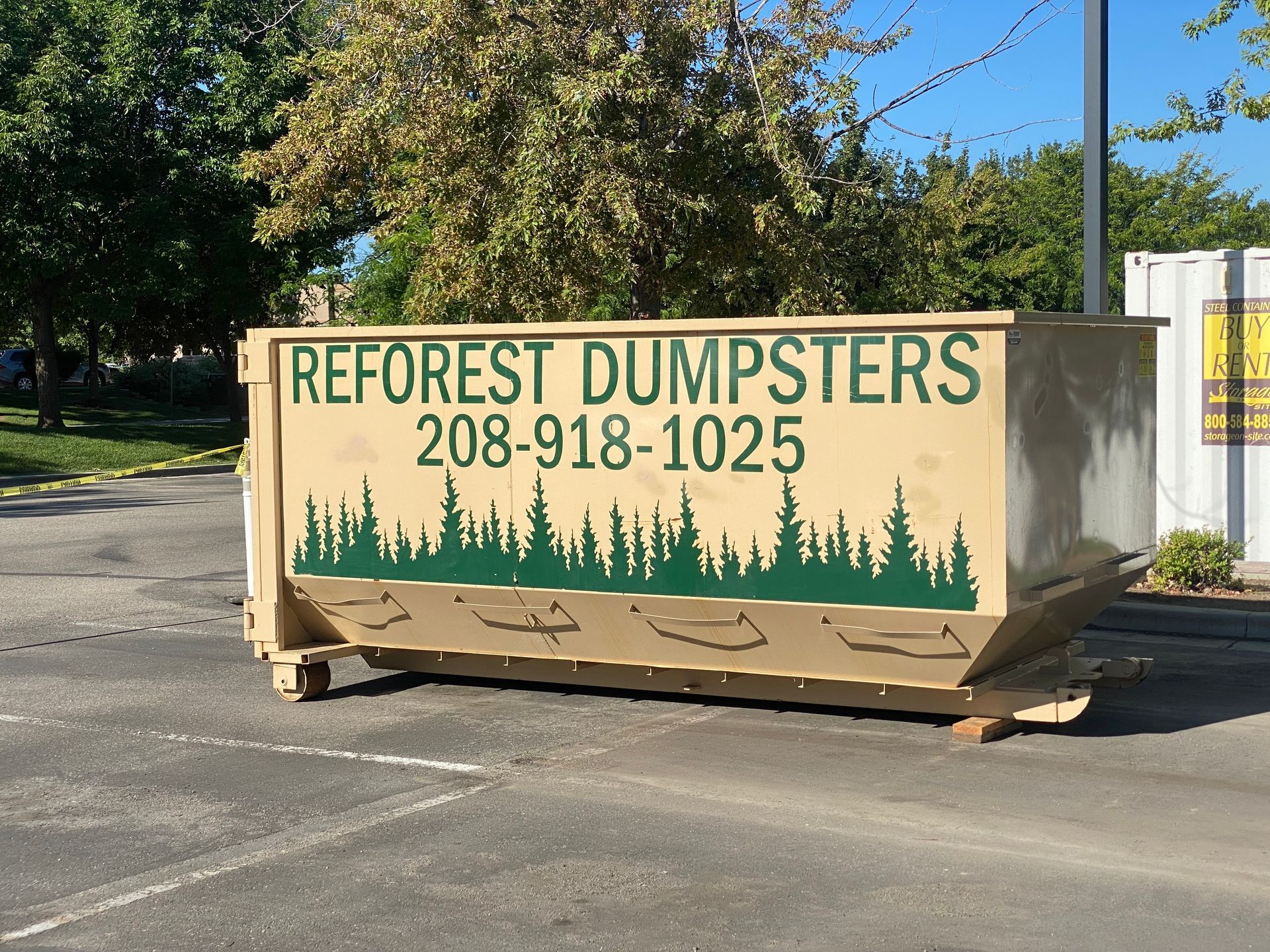 Tan dumpster with 