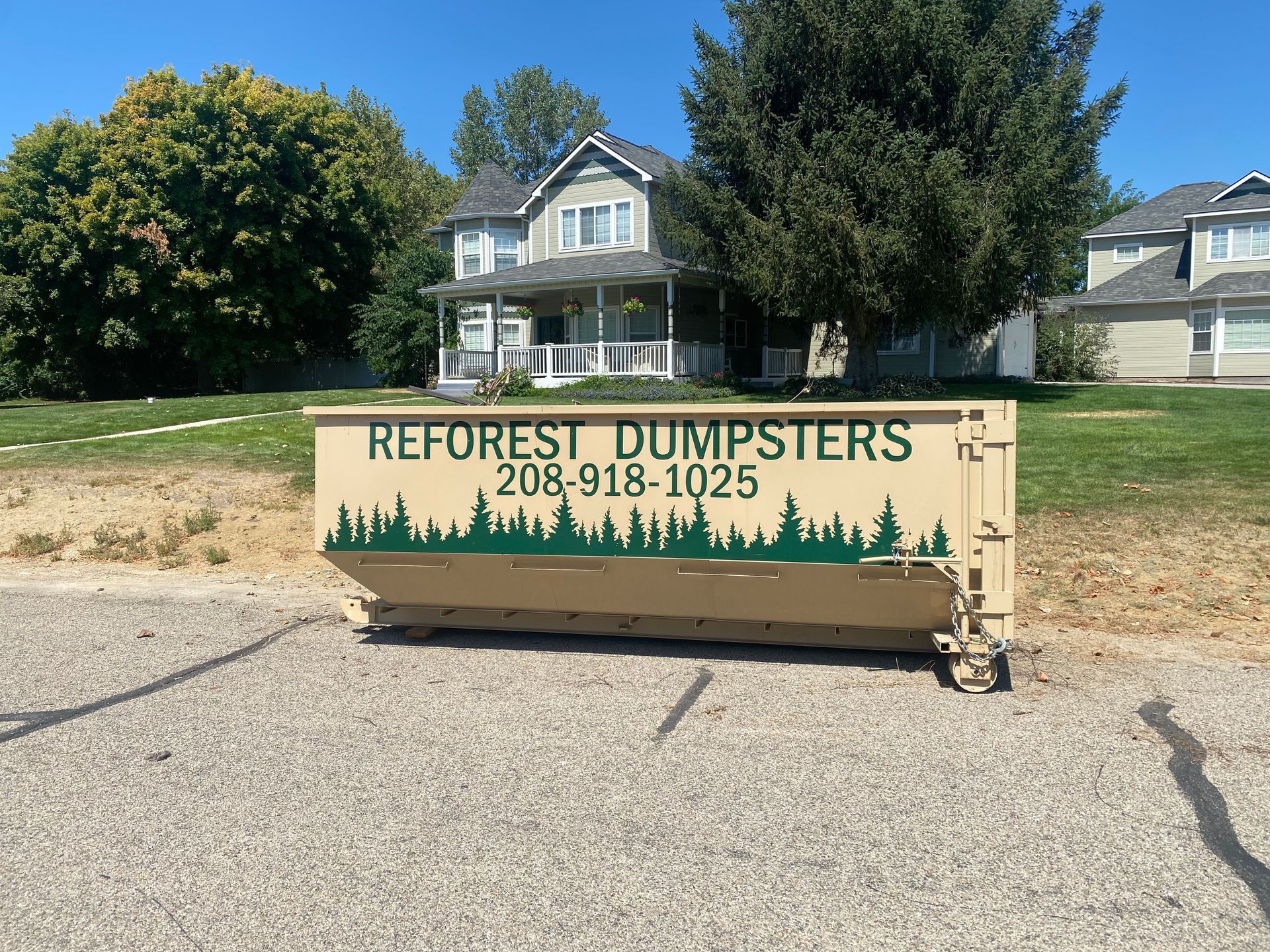 Tan dumpster trailer with