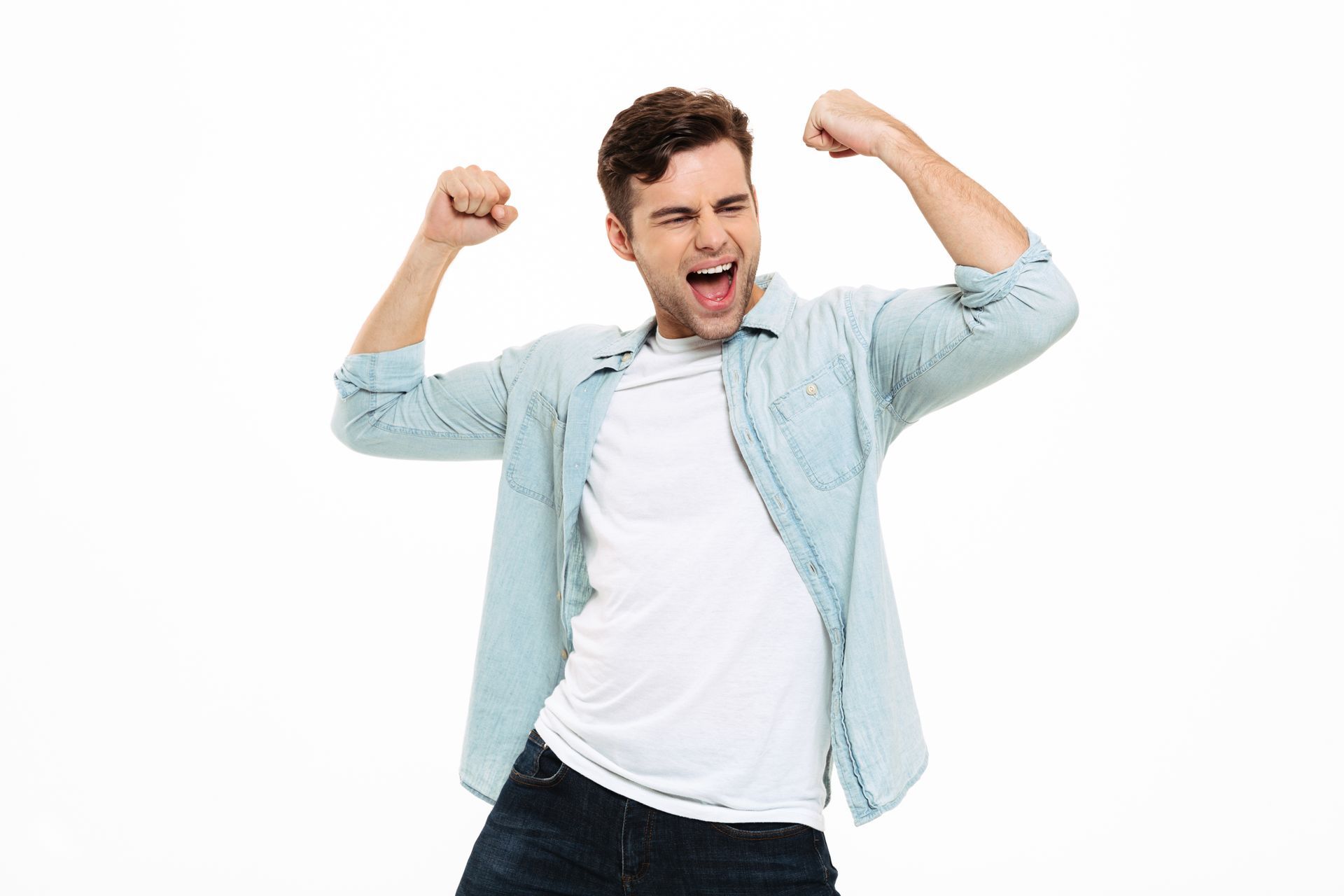 Man celebrates with fists clenched