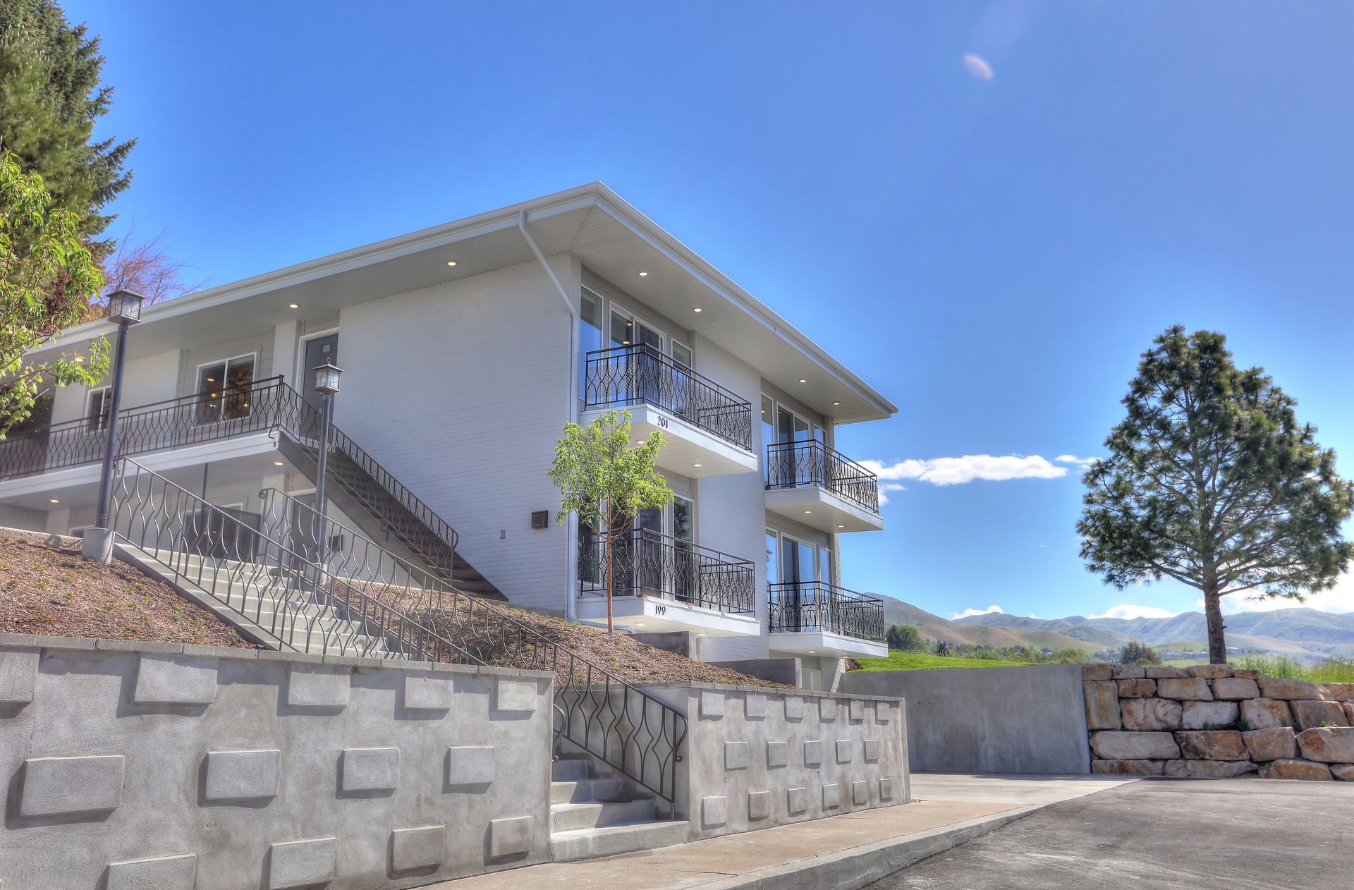 a large white house with stairs leading up to it - Click to go to Residents page